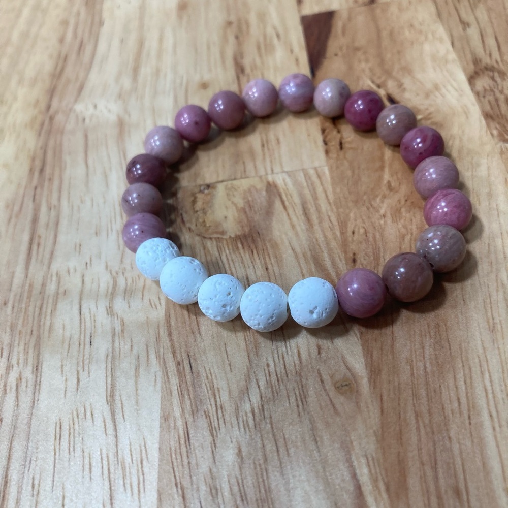 White lava rock diffuser bracelet with rhodonite stone beads.